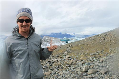 Mr. Pascale holding a piece of a glacier in Iceland Mr. Pascale holding a piece of a glacier in Iceland